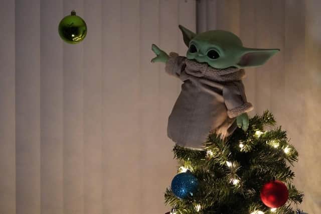 Baby Yoda toy is being used as a Christmas tree topper this year. (Pic: @ntbone / Twitter)