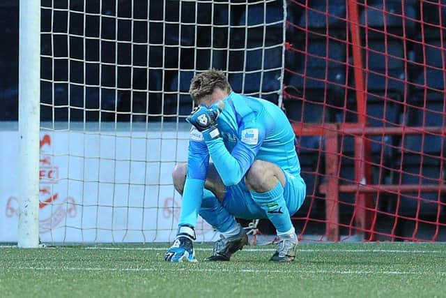 Goalkeeper Robbie Mutch at the end of Falkirk's defeat to Airdrie which cost the Bairns a place in the League One play-offs. Picture: Michael Gillen