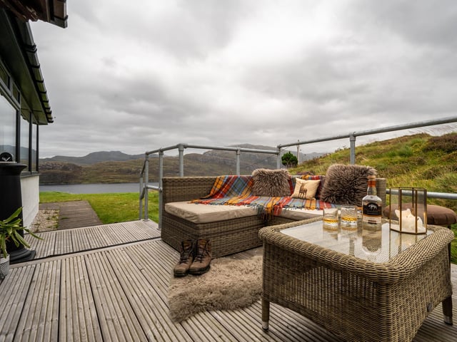 The venue is dog-friendly with a large lawn, and a small outdoor decked area.