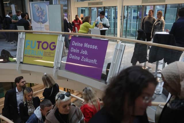 People, including many Ukrainians, attend a jobs fair for migrants and refugees earlier this week in Berlin, Germany.