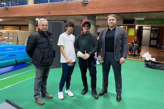 Chris Tidmarsh and Dmitry Leus with young fencers at Brixton Fencing Club