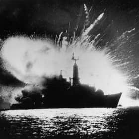 The missile magazines on board British Royal Navy Type 21 frigate, HMS Antelope, explode in San Carlos Water, off East Falkland, after attacks by the Argentine Air Force during the Falklands War, 24th May 1982. Photo: Martin Cleaver/Pool/Getty Images.