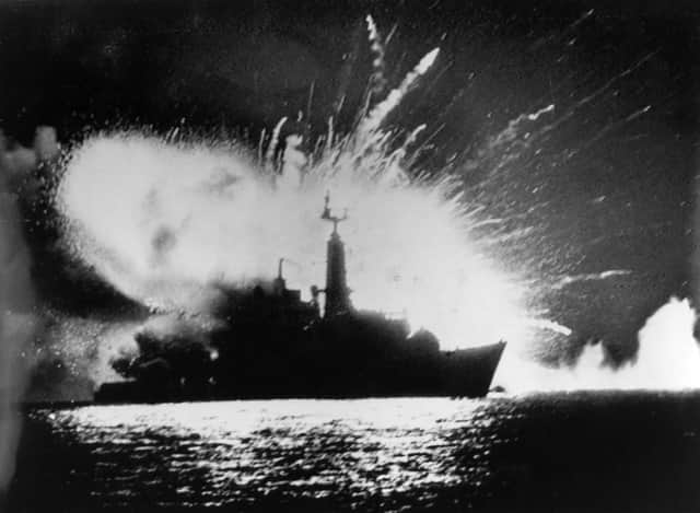 The missile magazines on board British Royal Navy Type 21 frigate, HMS Antelope, explode in San Carlos Water, off East Falkland, after attacks by the Argentine Air Force during the Falklands War, 24th May 1982. Photo: Martin Cleaver/Pool/Getty Images.