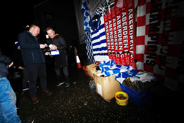 Scarfs are sold outside the ground on a historic night for the club.