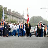A silent Orange Order band marches through the streets of Easterhouse in Glasgow on Saturday. Picture: PA