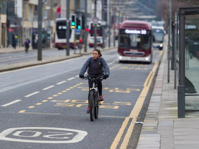A cyclist on Princes Street, Edinburgh, amid the ongoing coronavirus pandemic. (Photo by Mark Scates / SNS Group)