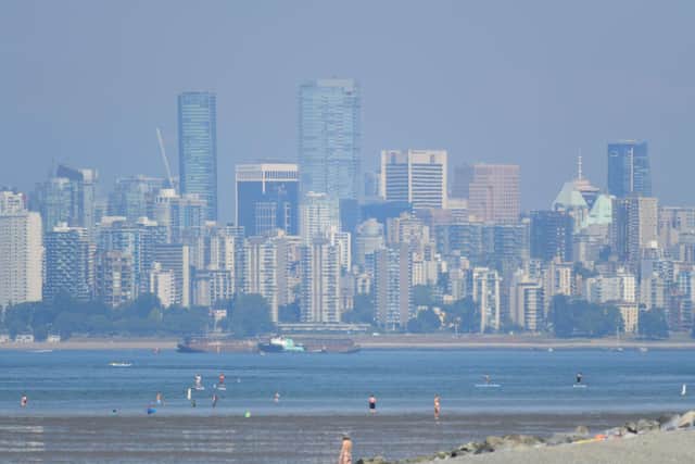The city of Vancouver, British Columbia, is seen through a heat haze as Canada experienced record-breaking temperatures (Picture: Don MacKinnon/AFP via Getty Images)
