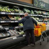 Shoppers in Sainsbury's, as the supermarket chain has unveiled £15 million of price cuts across cupboard essentials such as rice and pasta. Picture: Aaron Chown/PA Wire