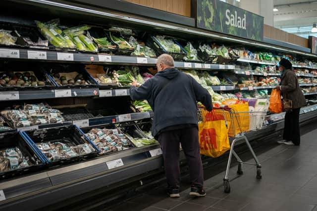 Shoppers in Sainsbury's, as the supermarket chain has unveiled £15 million of price cuts across cupboard essentials such as rice and pasta. Picture: Aaron Chown/PA Wire