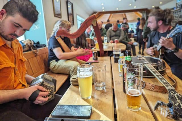 Drinks were poured and music played to celebrate the development for the community-owned pub which was purchased by residents on the Knoydart Peninsula in March 2022 (pic: Mark Harris)