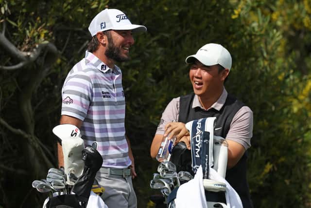 American Max Homa and Tom Kim of South Korea share a laugh during The Genesis Invitational at Riviera Country Club in Los Angeles in February. Picture: Harry How/Getty Images.