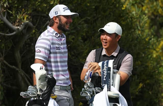 American Max Homa and Tom Kim of South Korea share a laugh during The Genesis Invitational at Riviera Country Club in Los Angeles in February. Picture: Harry How/Getty Images.