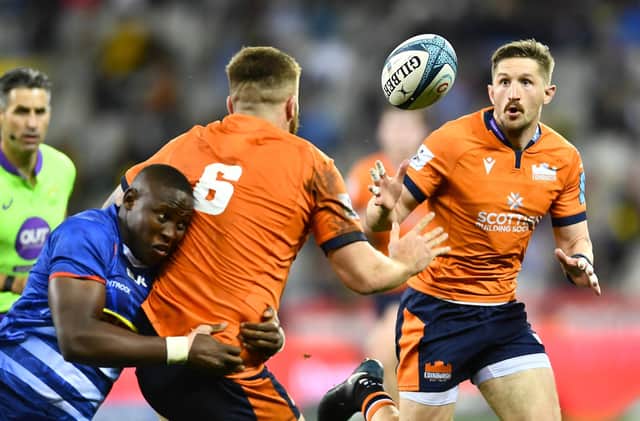 Luke Crosbie of Edinburgh offloads the ball to Henry Pyrgos during the URC quarter-final defeat to Stormers in Cape Town. (Photo by Ashley Vlotman/Gallo Images_