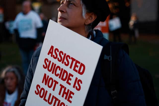 An opponent of assisted suicide outside Westminster. Picture: Benjamin Cremel/AFP via Getty Images