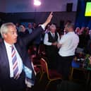 Reform UK leader Nigel Farage waves to supporters 