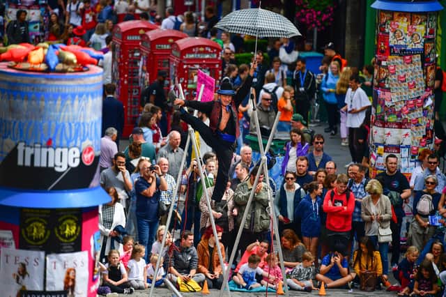 Edinburgh Festival Fringe entertainers perform on the Royal Mile last year (Picture: Jeff J Mitchell/Getty Images)