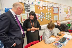 Education Secretary John Swinney speaks with pupils and their teacher in the time before coronavirus (Picture: Ian Rutherford)