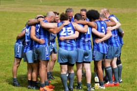 The Kingdom Kangaroos huddle at half time during one of their matches in 2022. Picture: John Kinninmonth