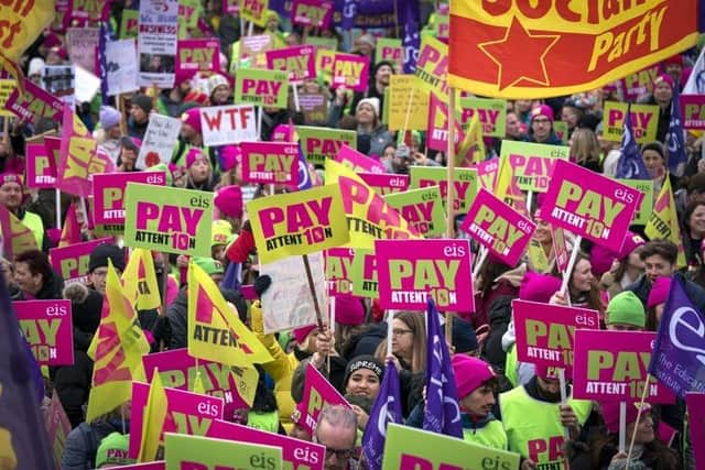 Members of the Educational Institute of Scotland (EIS) join teachers at a rally outside the Scottish Parliament in Edinburgh in a protest over pay. Picture date: Thursday November 24, 2022.