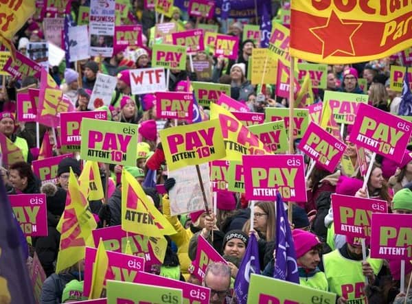 Members of the Educational Institute of Scotland (EIS) join teachers at a rally outside the Scottish Parliament in Edinburgh in a protest over pay. Picture date: Thursday November 24, 2022.