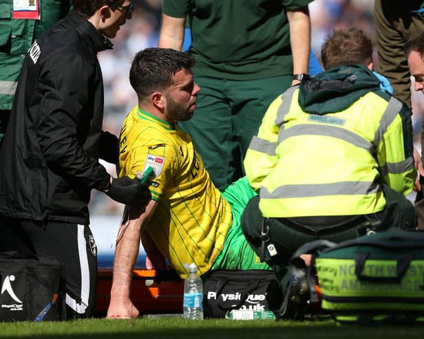 Grant Hanley is stretchered off after picking up an injury while playing for Norwich City against Blackburn Rovers at Ewood Park.