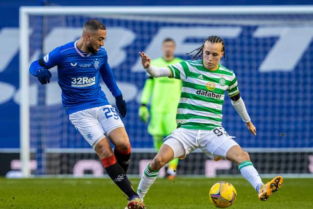 Diego Laxalt goes to challenge Rangers striker Kemar Roofe during Celtic's defeat at Ibrox. Picture: SNS