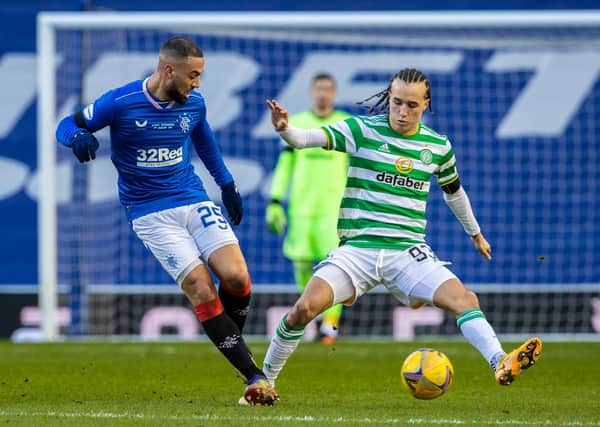 Diego Laxalt goes to challenge Rangers striker Kemar Roofe during Celtic's defeat at Ibrox. Picture: SNS