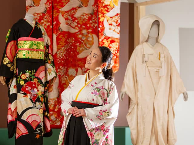 Calligraphy artist Tomoko Rowell has a close look at the exhibition Kimono: Kyoto to Catwalk, which will run at V&A Dundee from 4 May until 5 January. Picture: Michael McGurk