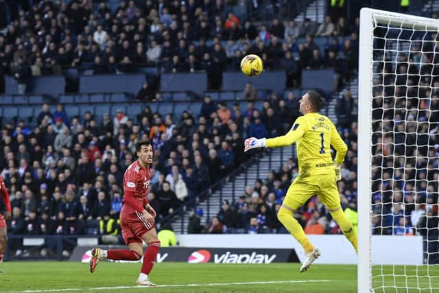 Bojan Miovski dinks Matty Kennedy's cross past Allan McGregor. (Photo by Rob Casey / SNS Group)