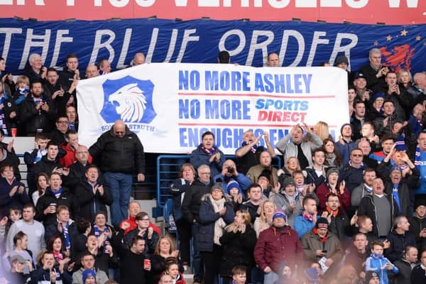 Rangers supporters display their opposition to Mike Ashley's involvement in the club during a match at Ibrox in March 2016. (Photo by Rob Casey/SNS Group).
