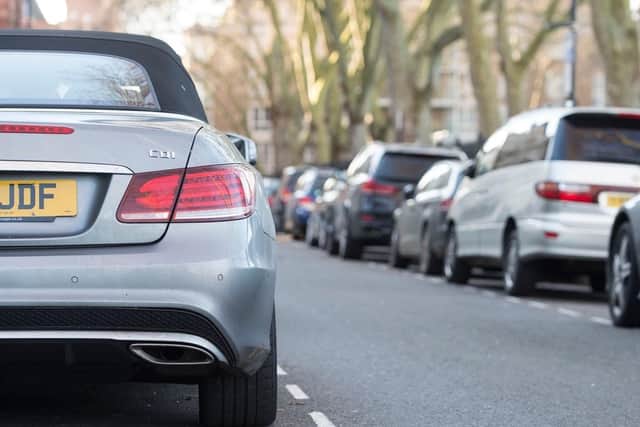 Cars parked on the road. PIC: Lauren Hurley/PA