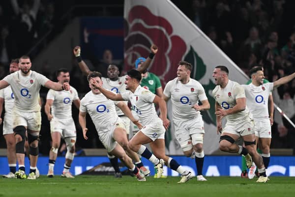 England players celebrate as Marcus Smith scores the winning drop goal in the Six Nations match against Ireland at Twickenham. (Photo by Mike Hewitt/Getty Images)