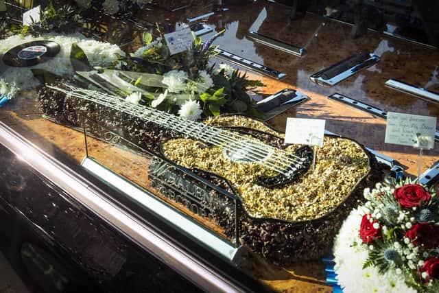 Floral tributes in the hearse outside Alloway Parish Church in Alloway, South Ayrshire, for the funeral of entertainer Sydney Devine  picture: Jane Barlow/PA Wire