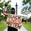 A Black Lives Matter protest in 2020 at the Melville Monument, which holds the statue of Henry Dundas (Lisa Ferguson)