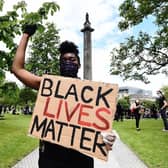 A Black Lives Matter protest in 2020 at the Melville Monument, which holds the statue of Henry Dundas (Lisa Ferguson)