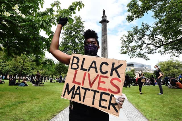 A Black Lives Matter protest in 2020 at the Melville Monument, which holds the statue of Henry Dundas (Lisa Ferguson)