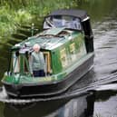 A canal boat heads from Edinburgh along the Union Canal towards Falkirk (Picture: Danny Lawson/PA)