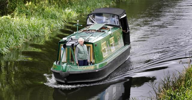 A canal boat heads from Edinburgh along the Union Canal towards Falkirk (Picture: Danny Lawson/PA)