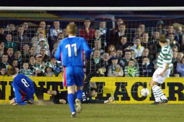 Caley Thistle striker Dennis Wyness (left) slides in to score past Javier Sanchez Broto (grounded) as Inverness defeat Celtic in 2003.