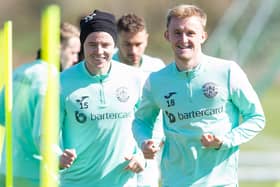 EDINBURGH, SCOTLAND - APRIL 20: Ewan Henderson (R) and Kevin Nisbet during a Hibernian training session at Hibernian Training Centre, on April 20, 2023, in Edinburgh, Scotland.  (Photo by Ewan Bootman / SNS Group)