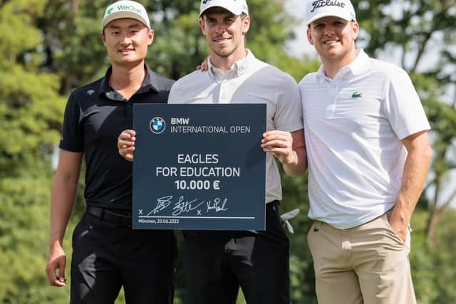 Gareth Bale is flanked by Haotong Li and Yannik Paul as they launched 'Eagles for Education', the BMW International Open. The BMW Group is donating the first 10,000 euros to the charity and will the  donate 1,000 euros for every eagle achieved during the DP World Tour event. Picture: Stefan Heigl