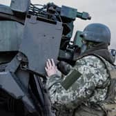 A Ukrainian serviceman prepares to fire with a CAESAR self-propelled howitzer towards Russian positions in eastern Ukraine on Wednesday.