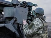 A Ukrainian serviceman prepares to fire with a CAESAR self-propelled howitzer towards Russian positions in eastern Ukraine on Wednesday.