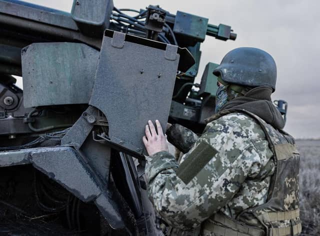 A Ukrainian serviceman prepares to fire with a CAESAR self-propelled howitzer towards Russian positions in eastern Ukraine on Wednesday.