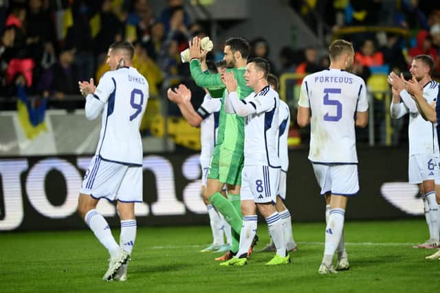 The Scotland players take the acclaim of a 3,000-strong travelling support after the 0-0 draw against Ukraine.