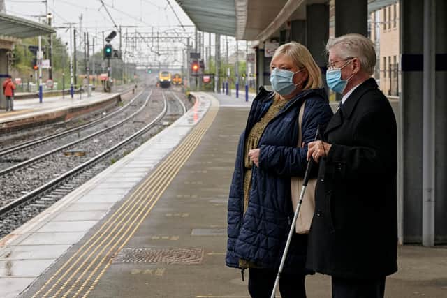 Sight Scotland recently installed new advertising at Haymarket Station to raise awareness among commuters.  Pictured is service user Joe being guided through the station. (Photograph: MAVERICK PHOTO AGENCY)