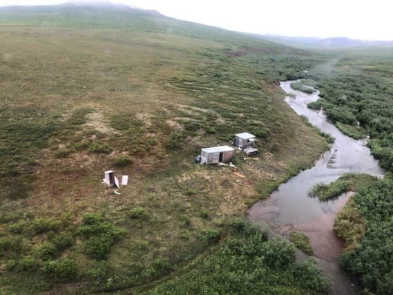 The remote mining camp near Nome, Alaska, where a coastguard crew rescued the survivor of a bear attack. The miner spent a week trying to protect himself from the bear, who frequently returned to his shack after first dragging him down to a river.  (Photo by HANDOUT/US COAST GUARD/AFP via Getty Images)