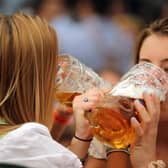 Women drink beer during the 2019 Oktoberfest in Munich (Picture: Johannes Simon/Getty Images)