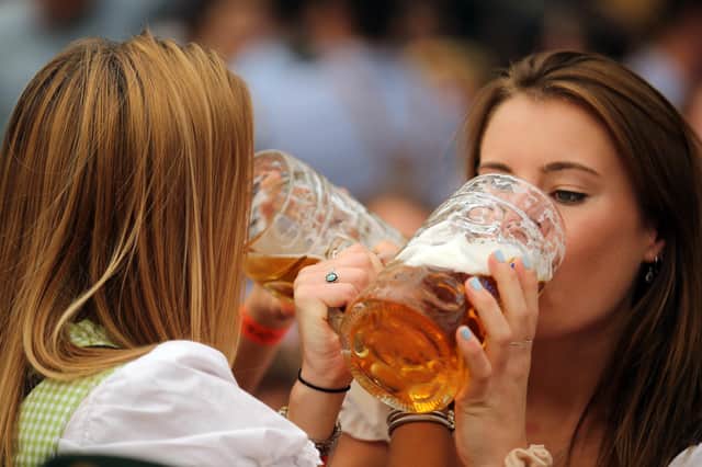 Women drink beer during the 2019 Oktoberfest in Munich (Picture: Johannes Simon/Getty Images)