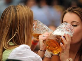 Women drink beer during the 2019 Oktoberfest in Munich (Picture: Johannes Simon/Getty Images)